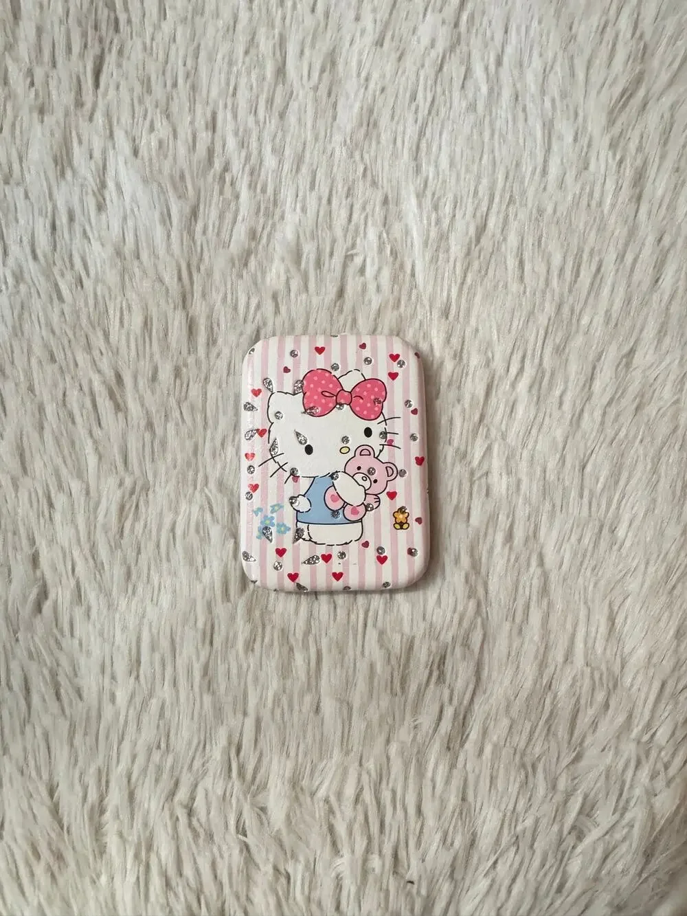 Hello Kitty pink & white striped compact mirror holding a teddy bear sparkly